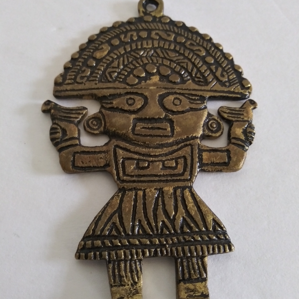 Vintage Mayan Aztec Incan tumi brass pendant.
